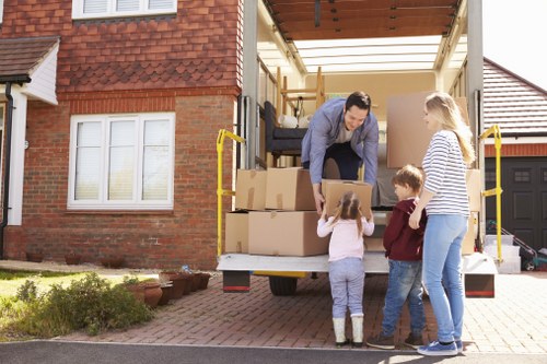 Family home removal setup in a Bromley street with furniture and boxes