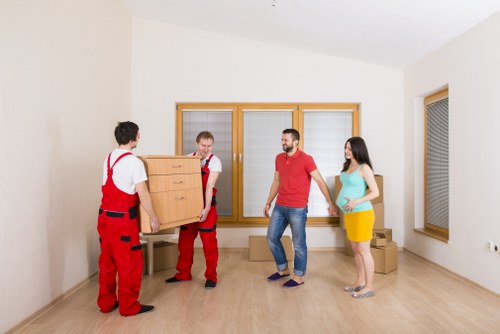 Professional movers loading furniture for a Bromley relocation