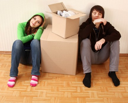 Unpacking boxes into a new Bromley property after moving day