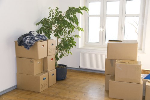 Packed moving boxes and furniture ready for transport in Bromley