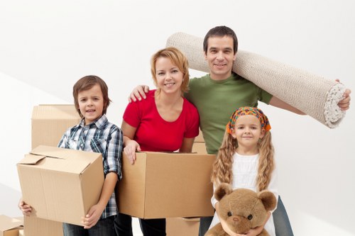 Packed moving boxes and furniture ready for a local removals service