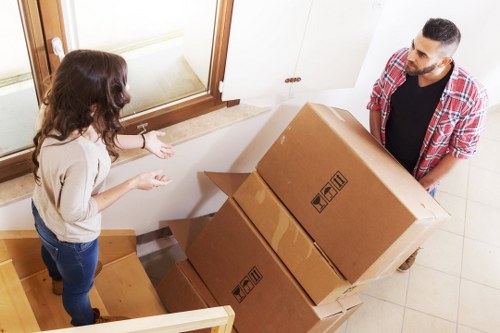 Commercial removals scene with office furniture and moving equipment in Bromley