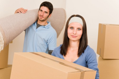 Removal team handling furniture during a Bromley property move