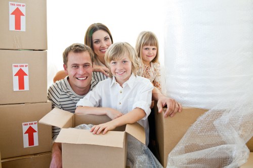 Removal van and moving team in a Bromley residential street