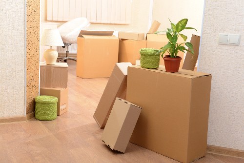 Removal team loading furniture into a van