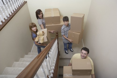 Professional movers unloading boxes at a Bromley property